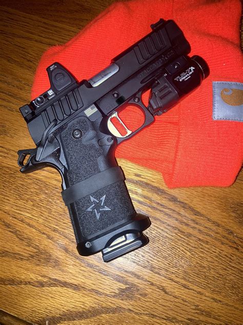 Staccato P 2011 pistol with an optional Red Dot sight and extended 20-round magazine. . Staccato 20 round magazine